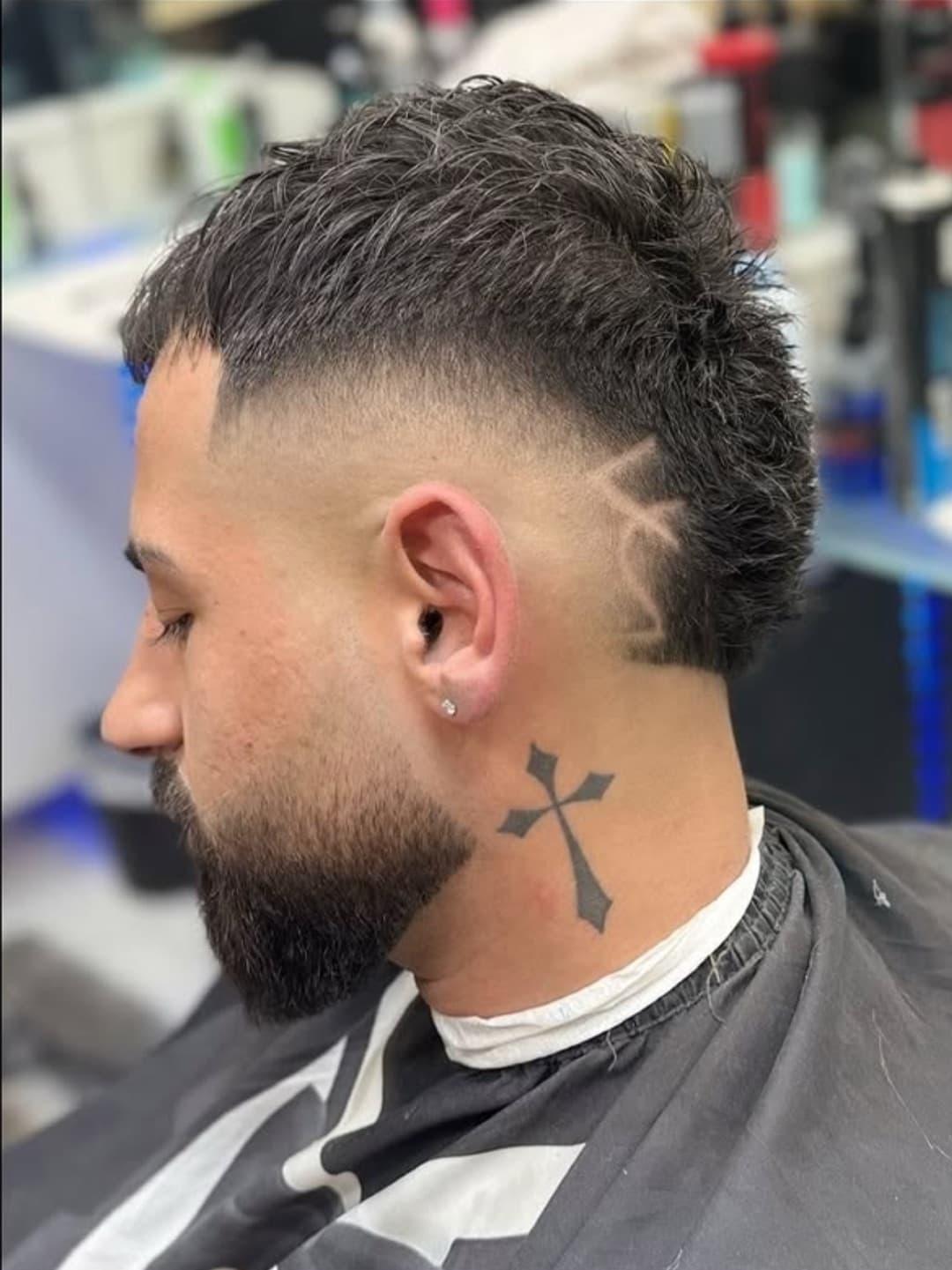 Skin fade with a star design, side profile